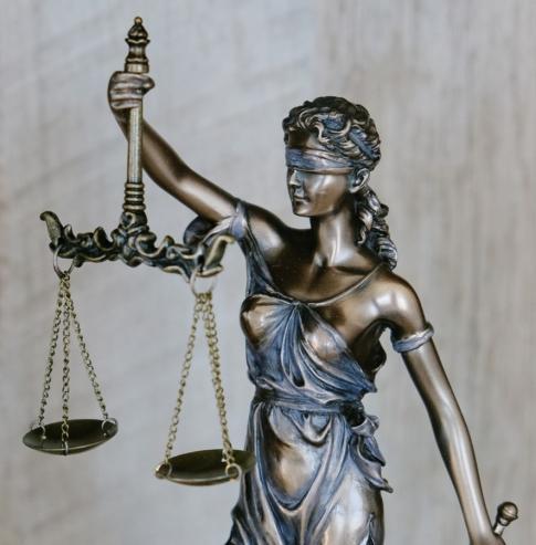 Bronze statue of Lady Justice holding scales, symbolizing SF Legal Law Firm's commitment to justice